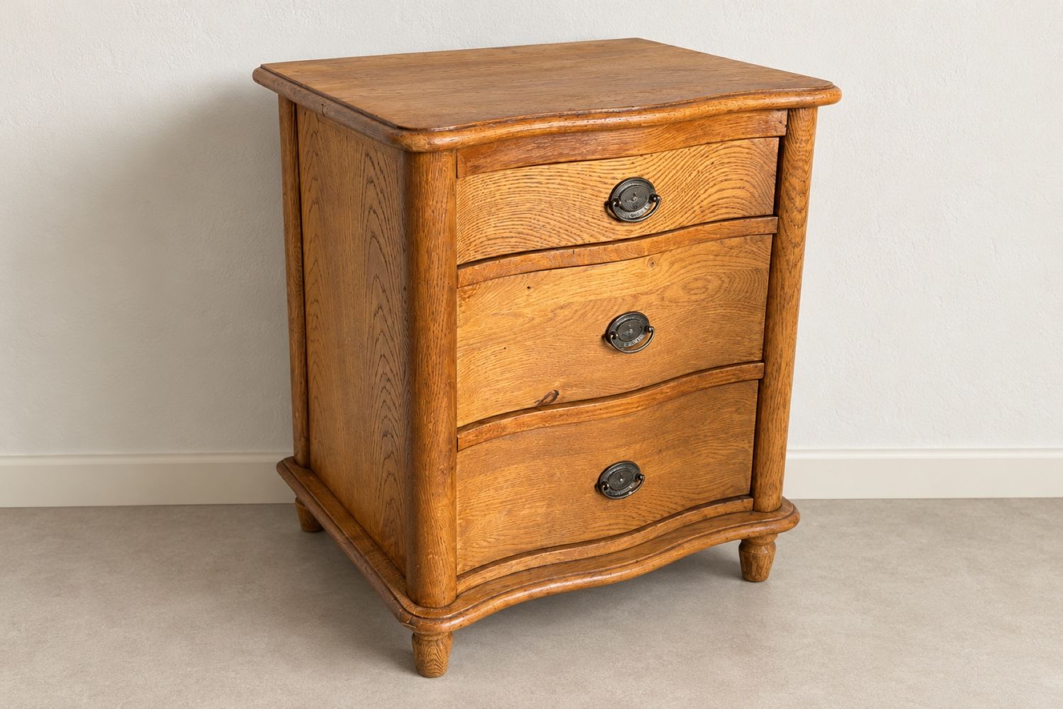 The same chest of drawers after: stripped back to the oak and oiled a warm honey brown